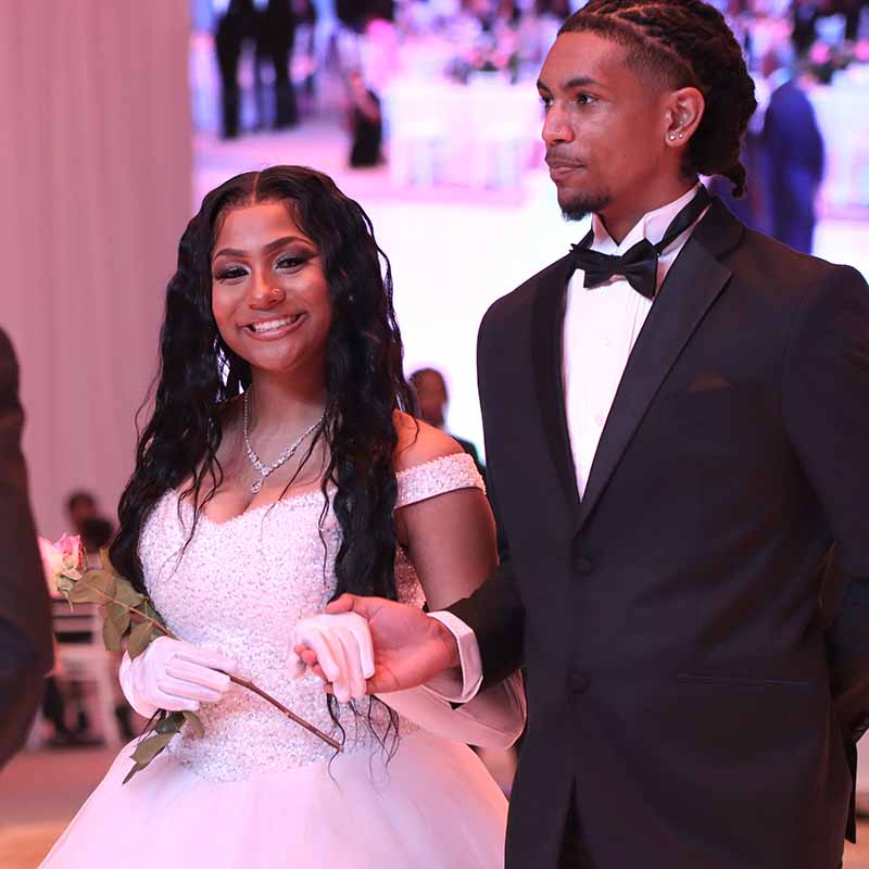 A young couple in formal attire.